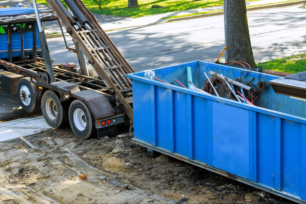 Construction trash loading the garbage dumpsters can waste construction trash dumpsters on house renovation.